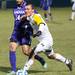 Wolverines Tyler Arnone dribbles the ball down the filed against the Purple Eagles Ken Cooper during Thursday nights game.Courtney Sacco I AnnArbor.com 